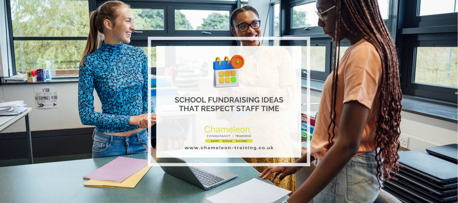 Teachers discussing a fundraising project in a school classroom